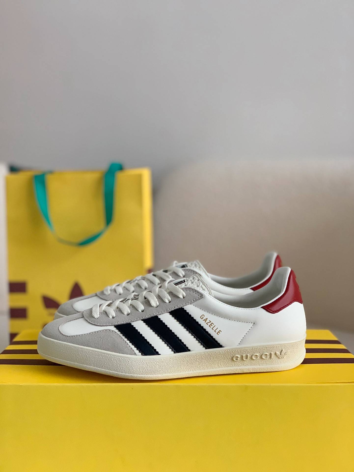 GU*I× Adidas sneakers