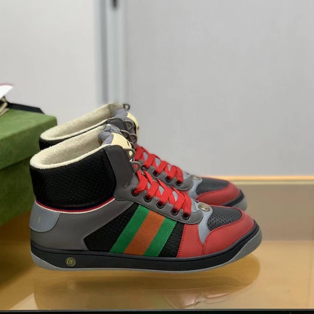 GU*IHigh-top Distressed sneakers